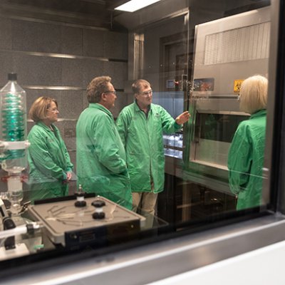 Professor Kevin Thomas showing Minderoo Foundation Chairman and Co-Founder Dr Andrew Forrest,  Minderoo Foundation Co-Chair and Co-Founder Nicola Forrest and UQ Vice Chancellor, Professor Debbie Terry inside the plastics contamination-controlled lab.